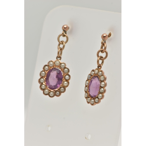 109 - A PAIR OF EARLY 20TH CENTURY AMETHYST AND SEED PEARL DROP EARRINGS, each earring of an oval form set... 