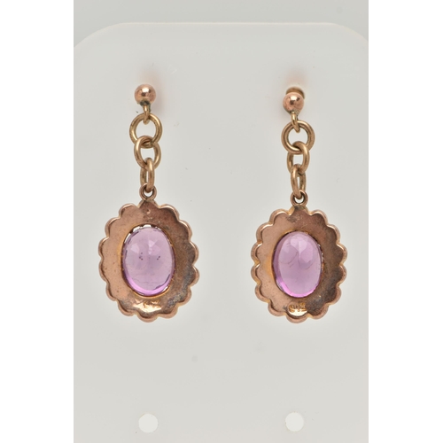 109 - A PAIR OF EARLY 20TH CENTURY AMETHYST AND SEED PEARL DROP EARRINGS, each earring of an oval form set... 