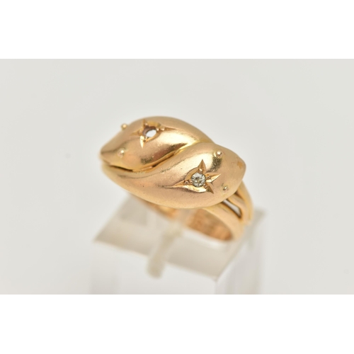 123 - AN EARLY 20TH CENTURY, 18CT GOLD DOUBLE SNAKE RING, one snake head set with a small single cut diamo... 