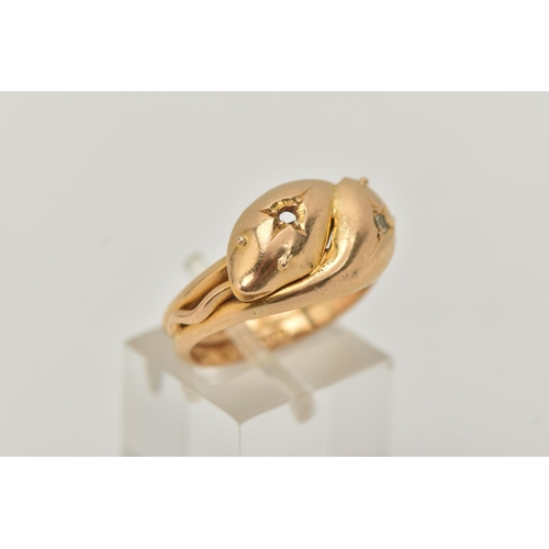 123 - AN EARLY 20TH CENTURY, 18CT GOLD DOUBLE SNAKE RING, one snake head set with a small single cut diamo... 