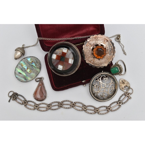 134 - A SMALL ASSORTMENT OF JEWELLERY, a white metal and hardstone Scottish brooch, a white metal and past... 