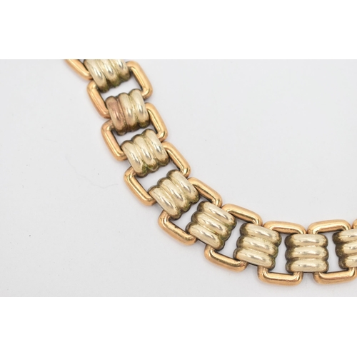 74 - A MODERN WHITE AND YELLOW METAL BRACELET, designed as a series of fifteen white metal grooved links,... 