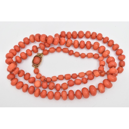 85 - A CORAL BEAD NECKLACE, designed as a series of approximately one hundred and four graduating coral b... 