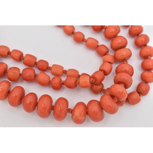 85 - A CORAL BEAD NECKLACE, designed as a series of approximately one hundred and four graduating coral b... 
