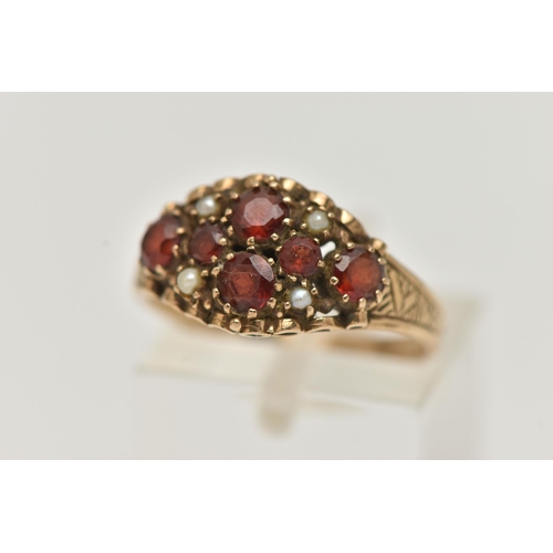 94 - A 9CT GOLD GARNET AND SPLIT PEARL RING, set with six circular cut garnets and four split pearl accen... 