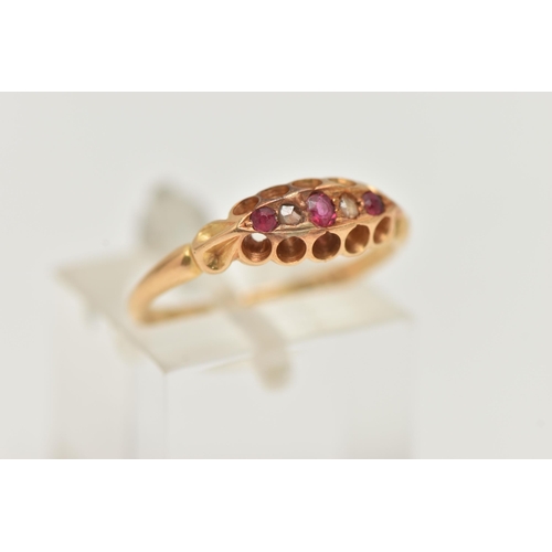96 - AN EARLY 20TH CENTURY RUBY AND DIAMOND BOAT RING, set with three small circular cut rubies, interspa... 