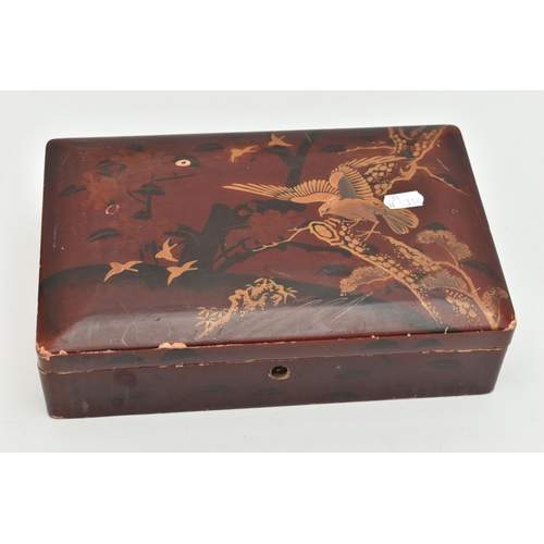 180 - A BOX WITH A SMALL QUANTITY OF JEWELLERY, a hinged lacquer box with eagle decor, approximate height ... 