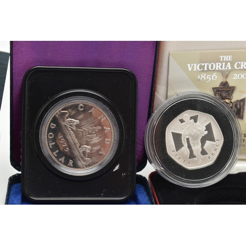 229 - A GROUP OF THREE BOXED SILVER COINS, to include a Royal Mint The Victoria Cross Fifty Pence with Cer... 