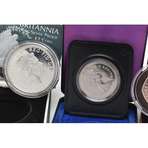 229 - A GROUP OF THREE BOXED SILVER COINS, to include a Royal Mint The Victoria Cross Fifty Pence with Cer... 