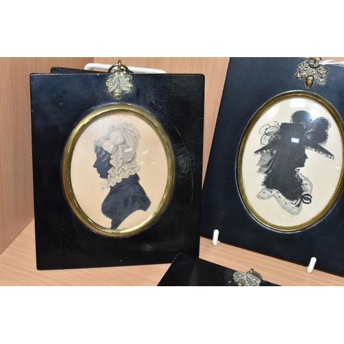 353 - FOUR FRAMED PAINTED SILHOUETTES, comprising three female portraits painted on paper, and one male po... 