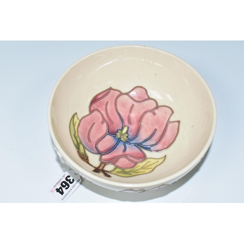 364 - A MOORCROFT POTTERY 'MAGNOLIA' PATTERN BOWL, of footed form, tube lined with pink magnolias, on a cr... 