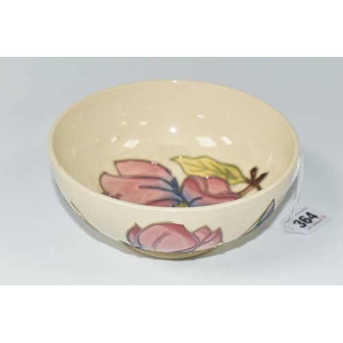 364 - A MOORCROFT POTTERY 'MAGNOLIA' PATTERN BOWL, of footed form, tube lined with pink magnolias, on a cr... 