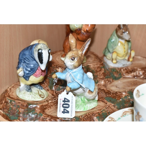 404 - A BESWICK BEATRIX POTTER'S FIGURE STAND WITH FIVE CHARACTERS, comprising 'Squirrel Nutkin' gold gilt... 