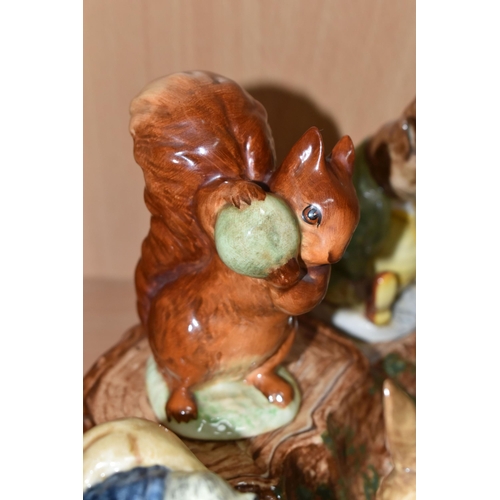 404 - A BESWICK BEATRIX POTTER'S FIGURE STAND WITH FIVE CHARACTERS, comprising 'Squirrel Nutkin' gold gilt... 