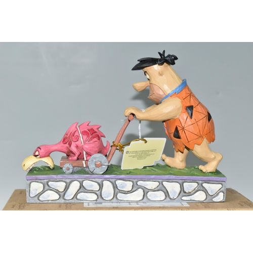 409 - A BOXED ENESCO 'THE FLINTSTONES' FIGURINE, by Jim Shore 4058333 Fred Flintstone 'Mower-A-Saurus' (1)... 