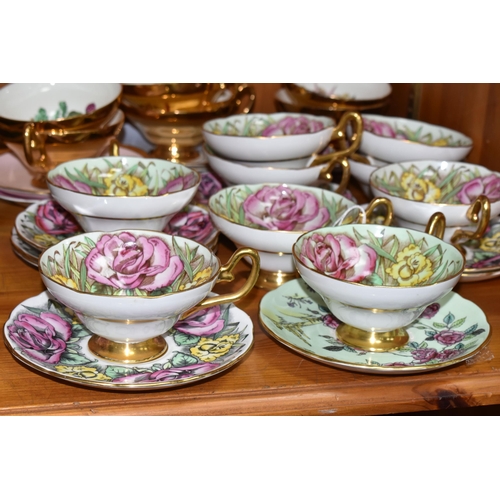 423 - A SET OF EIGHT TAYLOR & KENT FLORAL TEA CUPS AND NINE SAUCERS, pale green ground decorated with pink... 