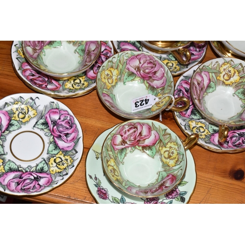 423 - A SET OF EIGHT TAYLOR & KENT FLORAL TEA CUPS AND NINE SAUCERS, pale green ground decorated with pink... 