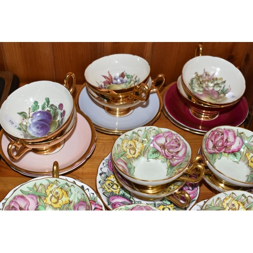 423 - A SET OF EIGHT TAYLOR & KENT FLORAL TEA CUPS AND NINE SAUCERS, pale green ground decorated with pink... 