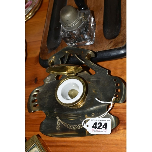 424 - A VICTORIAN MAHOGANY AND EBONISED DESK STAND, with two pen trays and two cuboid glass inkwells with ... 