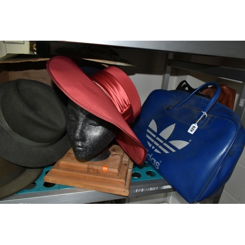 429 - A COLLECTION OF VINTAGE SUITCASES, TRUNKS, BAGS AND HATS, comprising a navy blue and white Revelatio... 