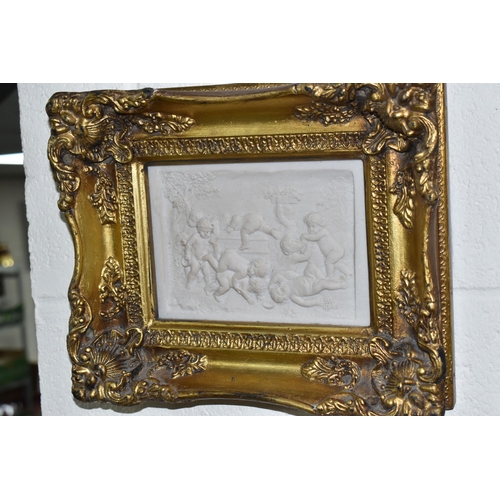 453 - THREE GILT FRAMED ITALIAN RECONSTITIUTED STONE PLAQUES, depicting Bacchanalian scenes of Putti, heig... 