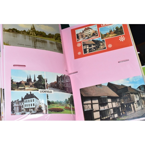 498 - FIVE ALBUMS OF POSTCARDS containing approximately 545 examples of places, streets, buildings, the ca... 