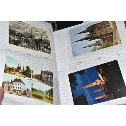 498 - FIVE ALBUMS OF POSTCARDS containing approximately 545 examples of places, streets, buildings, the ca... 