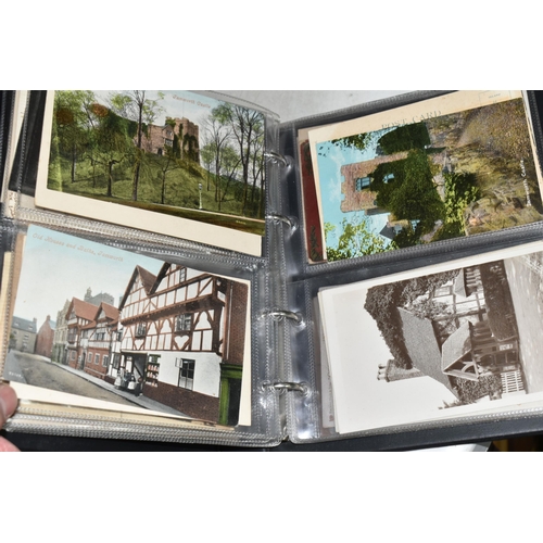 498 - FIVE ALBUMS OF POSTCARDS containing approximately 545 examples of places, streets, buildings, the ca... 