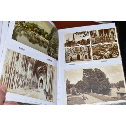 498 - FIVE ALBUMS OF POSTCARDS containing approximately 545 examples of places, streets, buildings, the ca... 