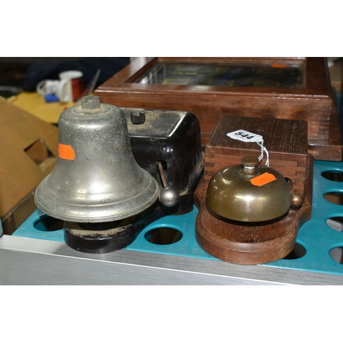 544 - A SERVANTS' BELL BOX AND TWO WALL MOUNTABLE BELLS, the black glass lidded bell box with six rectangu... 