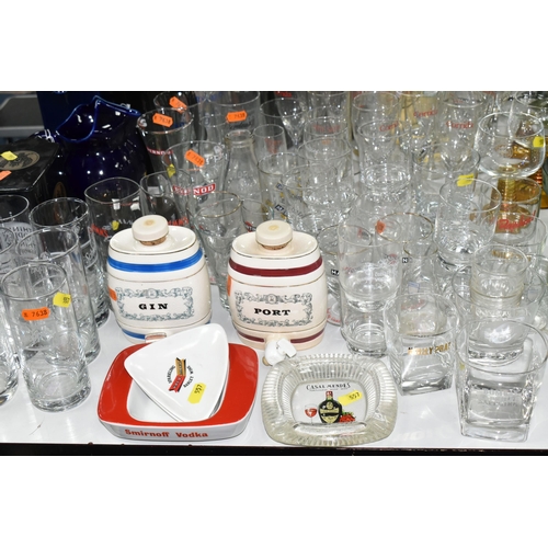 557 - A LARGE COLLECTION OF BREWERIANA, comprising glasses, water jugs, decanters and ashtrays, four boxed... 