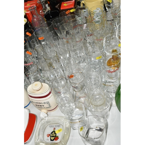 557 - A LARGE COLLECTION OF BREWERIANA, comprising glasses, water jugs, decanters and ashtrays, four boxed... 