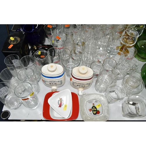 557 - A LARGE COLLECTION OF BREWERIANA, comprising glasses, water jugs, decanters and ashtrays, four boxed... 