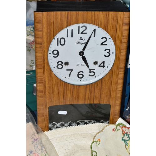 575 - TWO BOXES AND LOOSE TABLE LINEN AND SUNDRY ITEMS ETC, to include a Rhythm 30 day chiming wall clock ... 