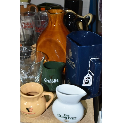 579 - BREWERIANA: A LARGE QUANTITY OF WHISKY ADVERTISING WATER JUGS AND GLASSES, one 1920's copper serving... 