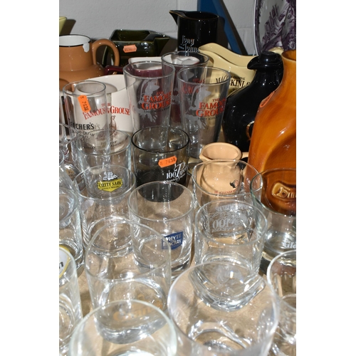 579 - BREWERIANA: A LARGE QUANTITY OF WHISKY ADVERTISING WATER JUGS AND GLASSES, one 1920's copper serving... 