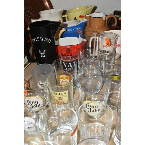 579 - BREWERIANA: A LARGE QUANTITY OF WHISKY ADVERTISING WATER JUGS AND GLASSES, one 1920's copper serving... 