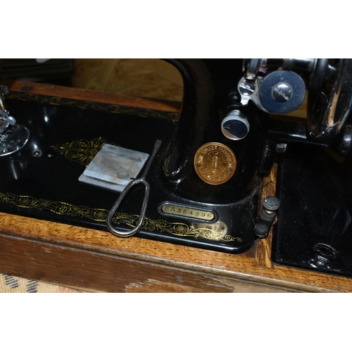 584 - THREE VICTORIAN SINGER SEWING MACHINES, comprising a Singer Model 66K sewing machine, decorated with... 