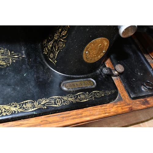 584 - THREE VICTORIAN SINGER SEWING MACHINES, comprising a Singer Model 66K sewing machine, decorated with... 