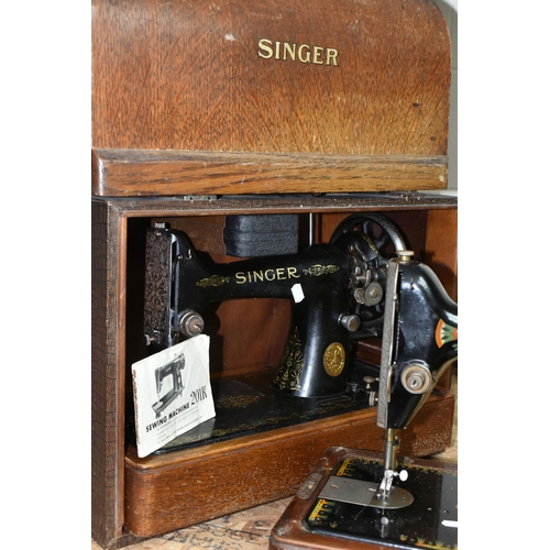 584 - THREE VICTORIAN SINGER SEWING MACHINES, comprising a Singer Model 66K sewing machine, decorated with... 