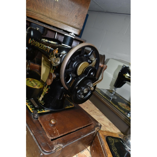 584 - THREE VICTORIAN SINGER SEWING MACHINES, comprising a Singer Model 66K sewing machine, decorated with... 