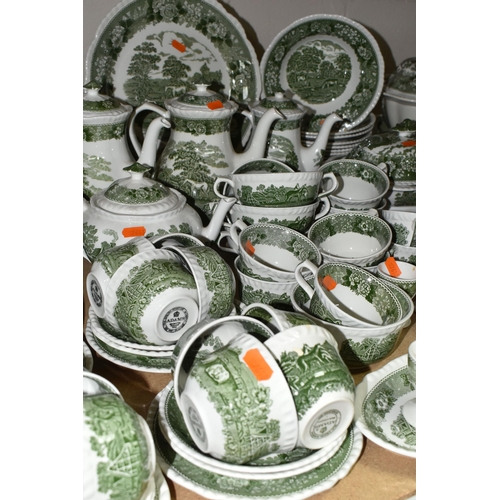 585 - A LARGE QUANTITY OF ADAMS GREEN AND WHITE 'ENGLISH SCENIC' PATTERN DINNERWARE, comprising two covere... 