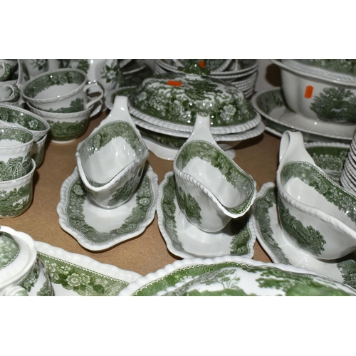 585 - A LARGE QUANTITY OF ADAMS GREEN AND WHITE 'ENGLISH SCENIC' PATTERN DINNERWARE, comprising two covere... 