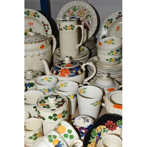 594 - A LARGE QUANTITY OF ADAM'S HANDPAINTED TITIAN WARE, comprising two covered tureens, gravy jug (crack... 