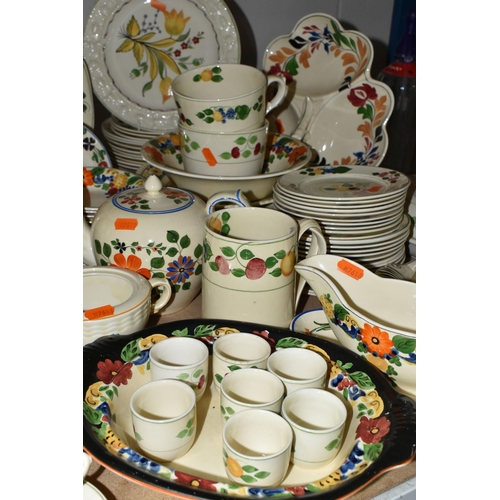 594 - A LARGE QUANTITY OF ADAM'S HANDPAINTED TITIAN WARE, comprising two covered tureens, gravy jug (crack... 