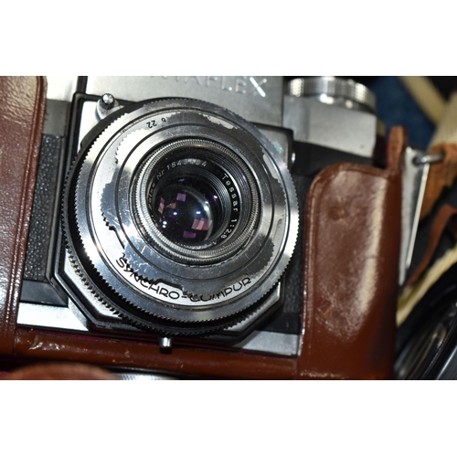 596 - TWO VINTAGE CAMERAS, comprising a Zeiss Ikon Contaflex camera with a Carl Zeiss Tessar 45mm lens in ... 