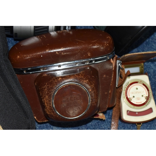 596 - TWO VINTAGE CAMERAS, comprising a Zeiss Ikon Contaflex camera with a Carl Zeiss Tessar 45mm lens in ... 