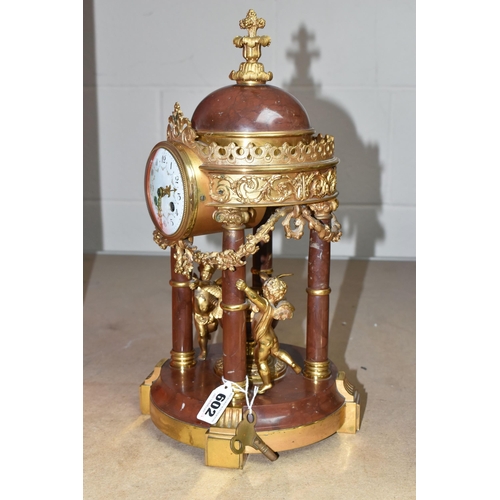 602 - A LATE 19TH CENTURY MARBLE AND GILT METAL MANTEL CLOCK IN THE FORM OF A FOUR COLUMN ROTUNDA TEMPLE, ... 