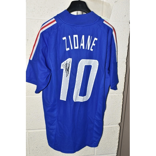 724 - A FRANCE REPLICA HOME FOOTBALL SHIRT SIGNED BY ZINEDINE ZIDANE, signed to the white figure 1 of the ... 