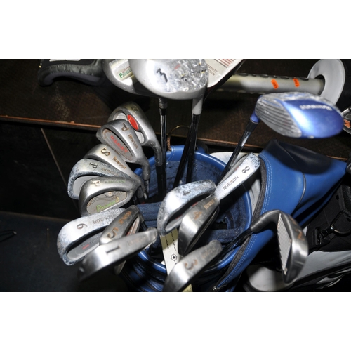 1063 - THREE GOLF BAGS CONTAINING TWENTY SEVEN IRONS, twenty one drivers and three putters from makers such... 